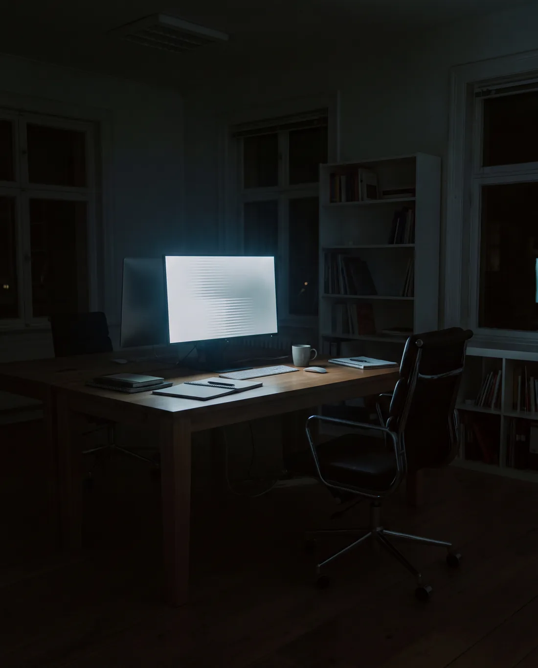 A monitor in a dark office, its page of results fading out to nothing